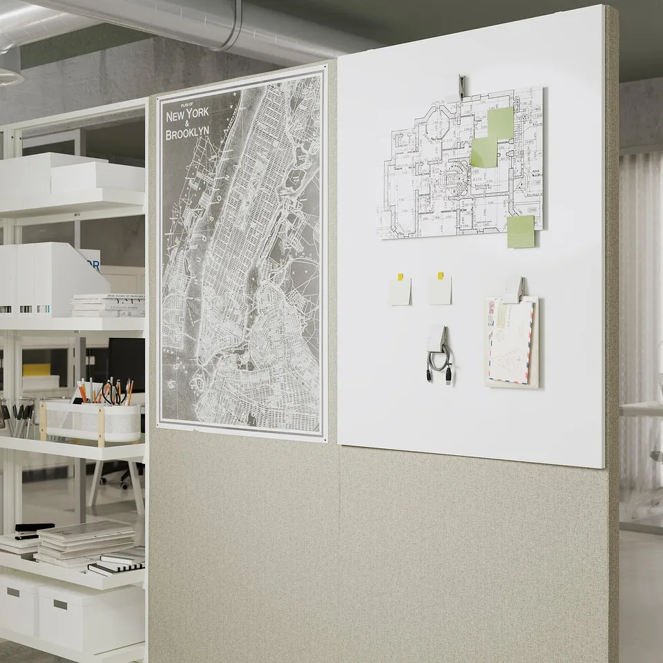 Office space with MITTZON acoustic screens. Whiteboard attached for notes and maps. Shelves with office supplies on the side.