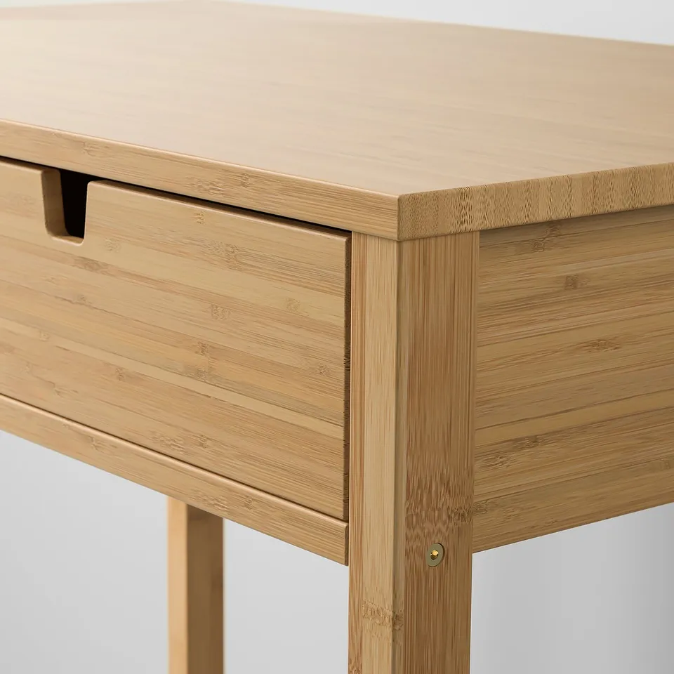 High-quality bamboo dressing table with smooth, accessible drawer, showcasing natural wood grain.
