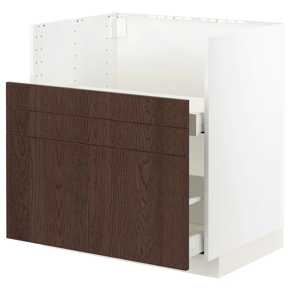 A white METOD kitchen cabinet with dark brown wooden drawer fronts. The cabinet multiple drawers and shelves.