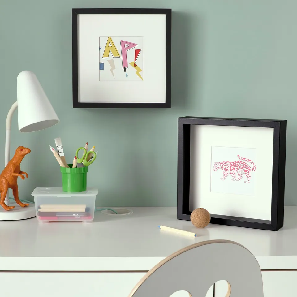 Tiger art desk with lamp and toy.