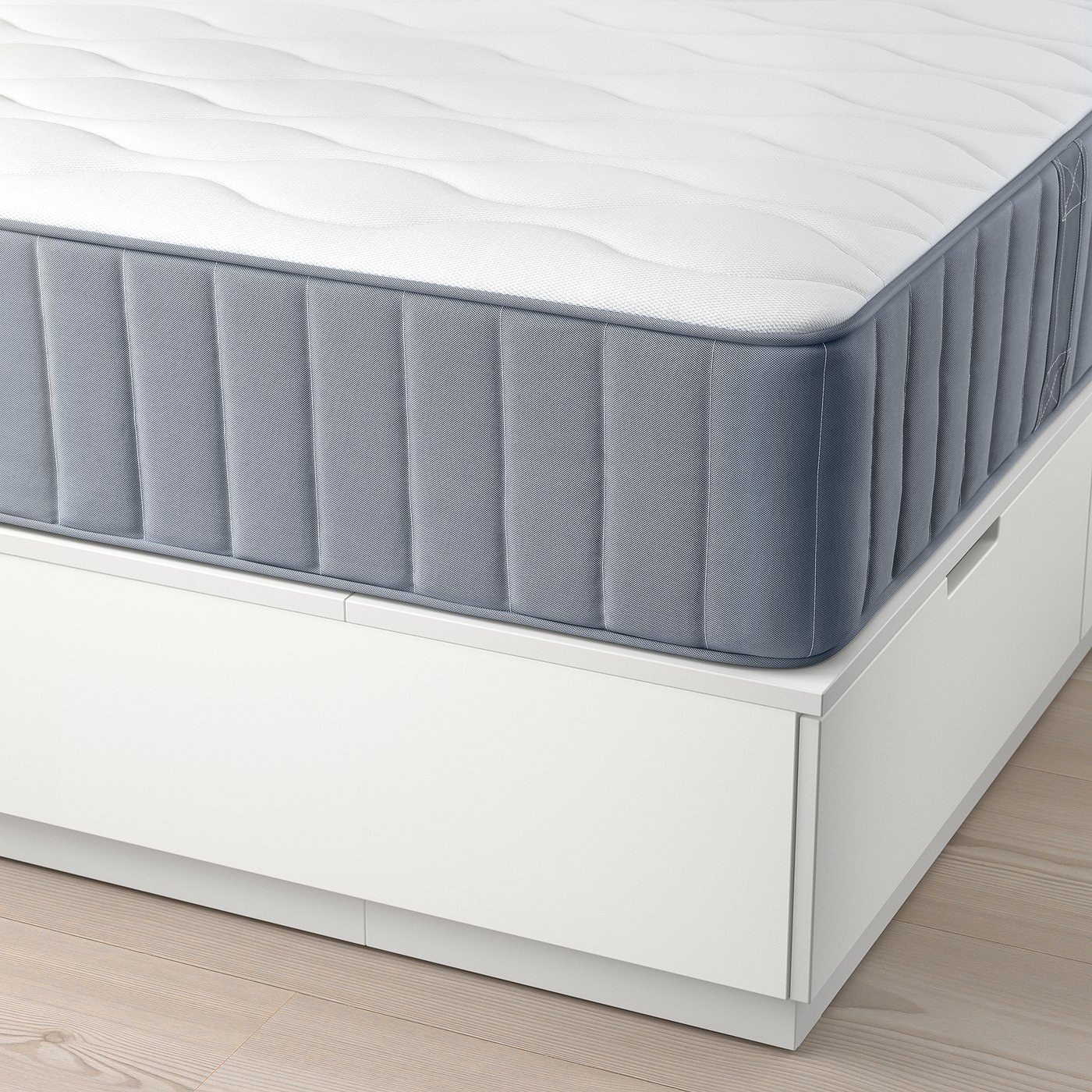 NORDLI bed frame with white mattress and storage drawers.