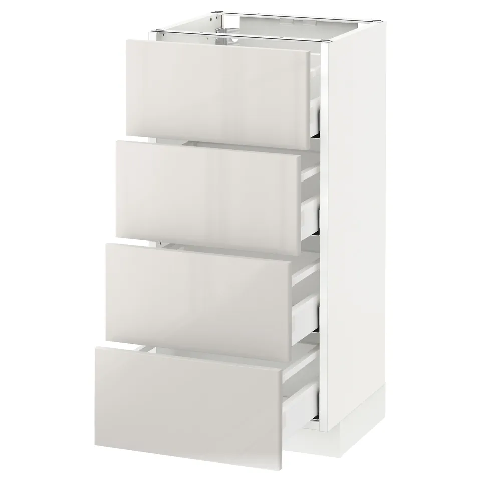 White METOD kitchen unit with four modern, high-gloss grey drawers, sleek and clean design.