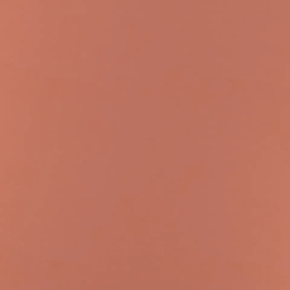 Smooth, vibrant orange surface of EKBACKEN laminate worktop, showcasing its durable and easy-to-clean finish.