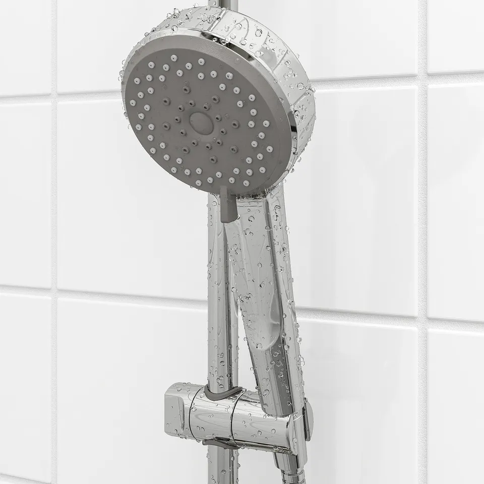 A chrome-plated shower head with multiple spray functions, including full, mist, and massage. The shower head is attached to a holder.