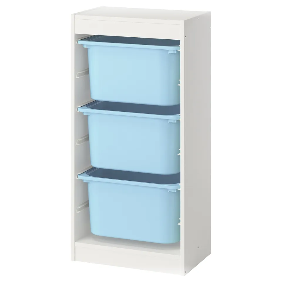 A TROFAST storage unit, white with three blue plastic boxes, stacked vertically for child-friendly organisation.