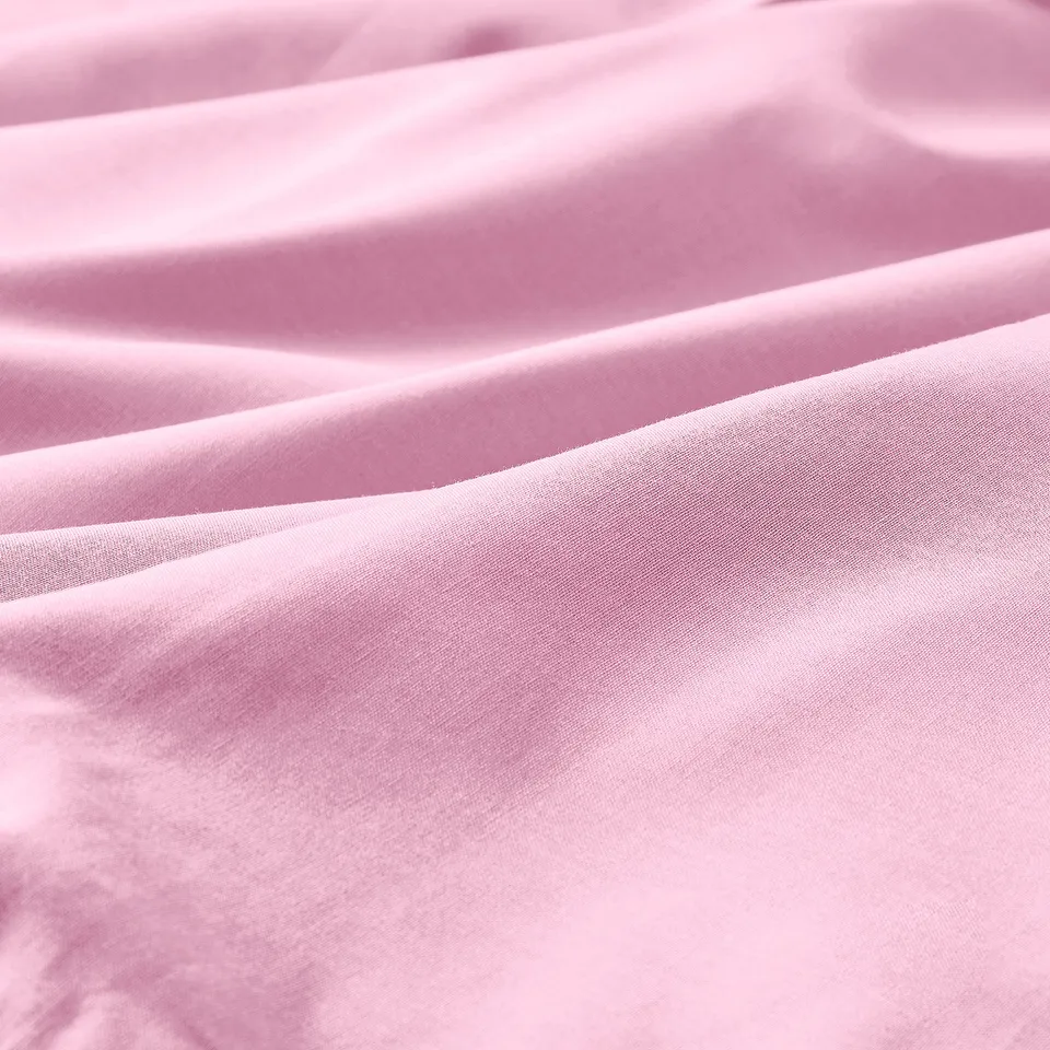 Soft pink pillowcase, smooth texture, high-quality cotton feel.
