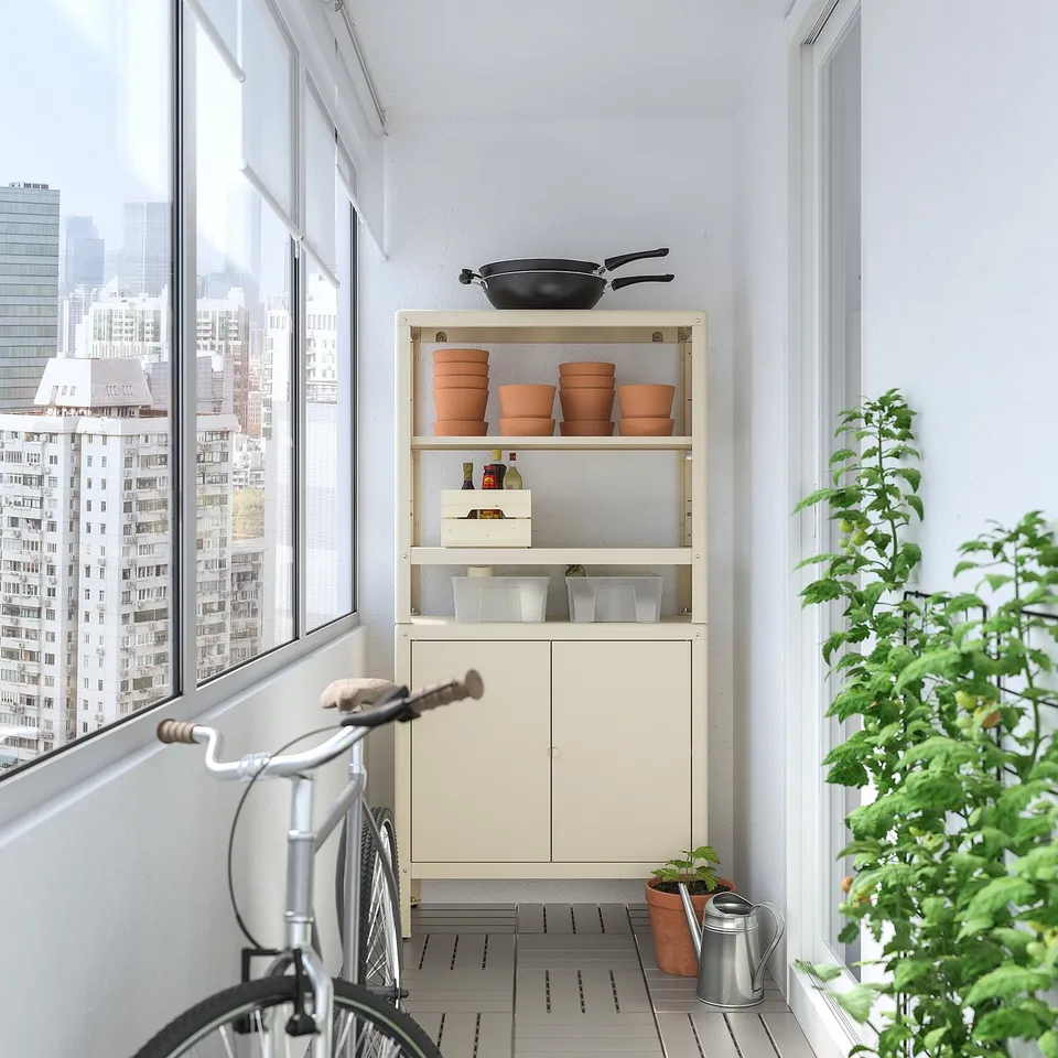 Balcony with KOLBJÖRN storage unit, bike, and plant