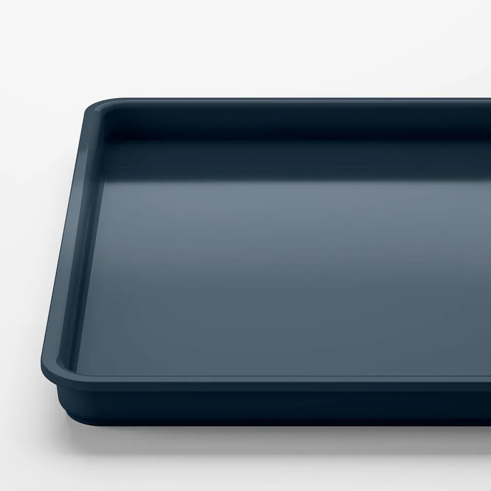 Dark blue rectangular plastic container, smooth surface, clean edges.