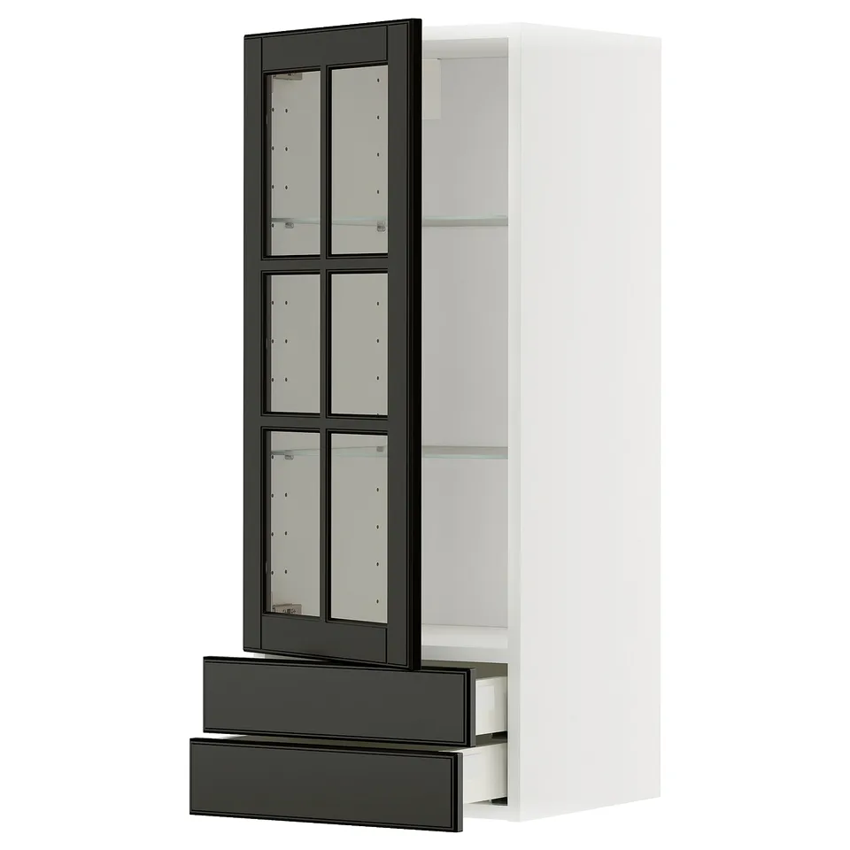 Modern kitchen cabinet in white with black glass doors. Tall with shelves and drawers.