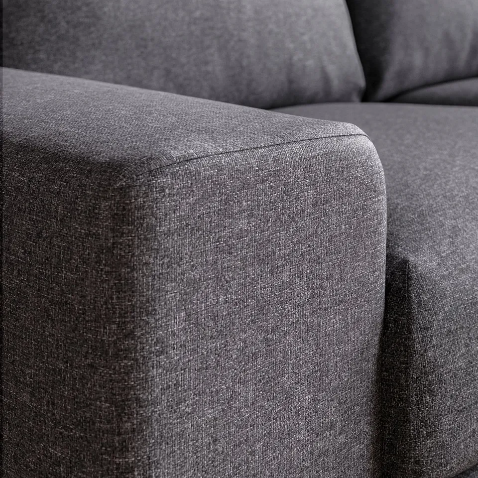 Close-up of VIMLE sofas plush, dark grey upholstery. Soft, textured fabric feels durable yet comfortable.