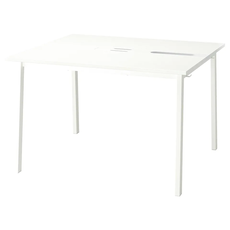 A MITTZON white desk with four metal legs, a steel inside leg, and cable management.