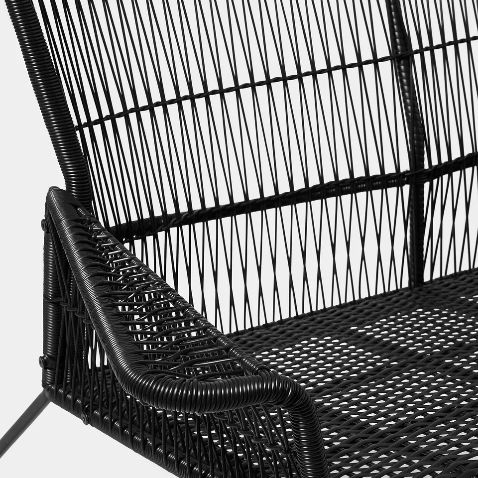 Black wicker patio chair, intricately woven, showcasing robust construction and modern design.