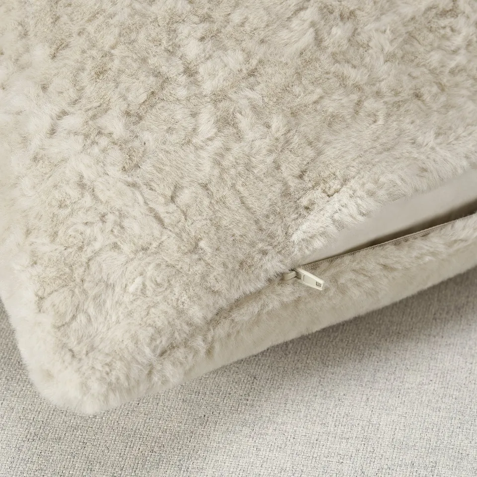 Fuzzy beige pillow cover with real zip, soft, made from recycled polyester.
