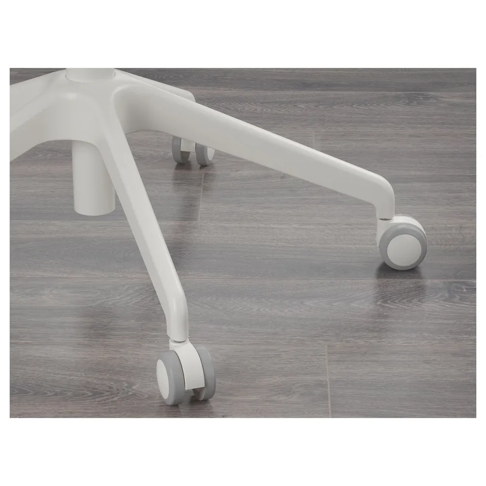 Close-up of a modern office chairs base and casters on wooden flooring, showcasing the robust design and mobility.