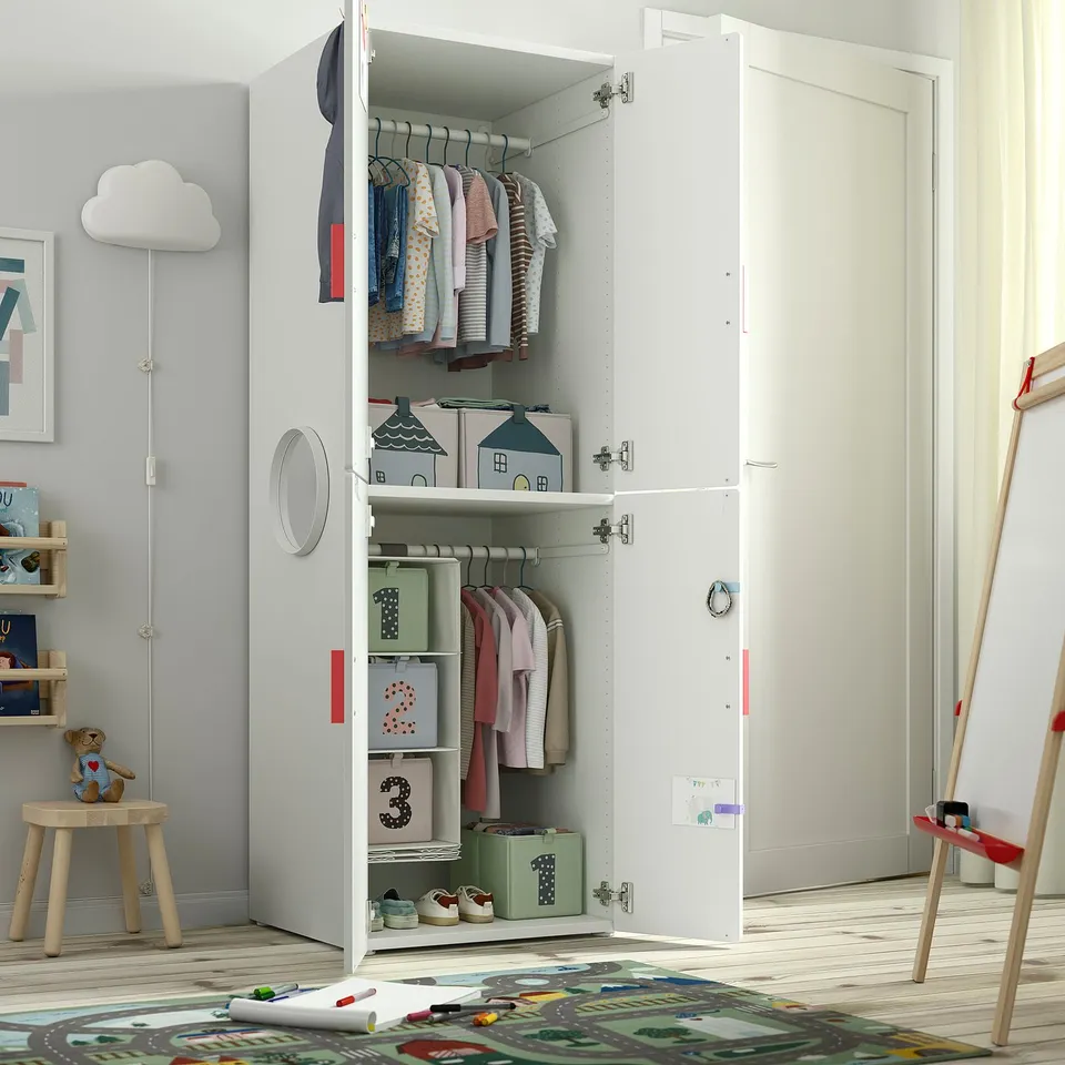 Kids wardrobe with clothes, storage, and soft-close doors. Deep enough for adult-sized hangers.