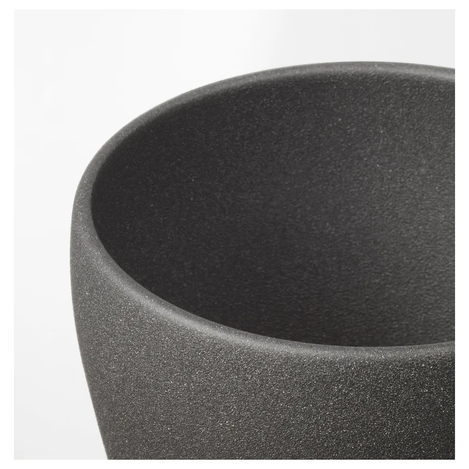 Sleek, modern, black planter made of textured earthenware with a smooth, pigmented powder coat finish.