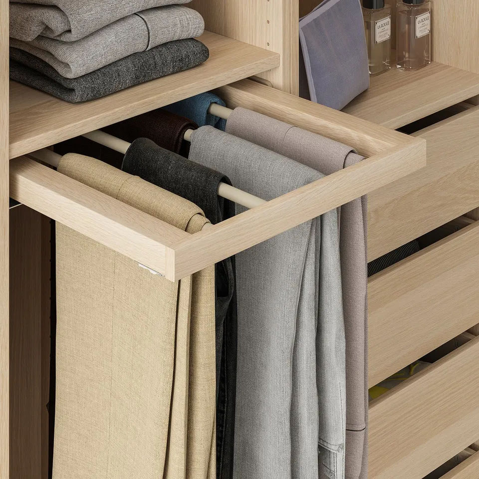 Wooden wardrobe organiser with hanging trousers and neatly folded clothes.