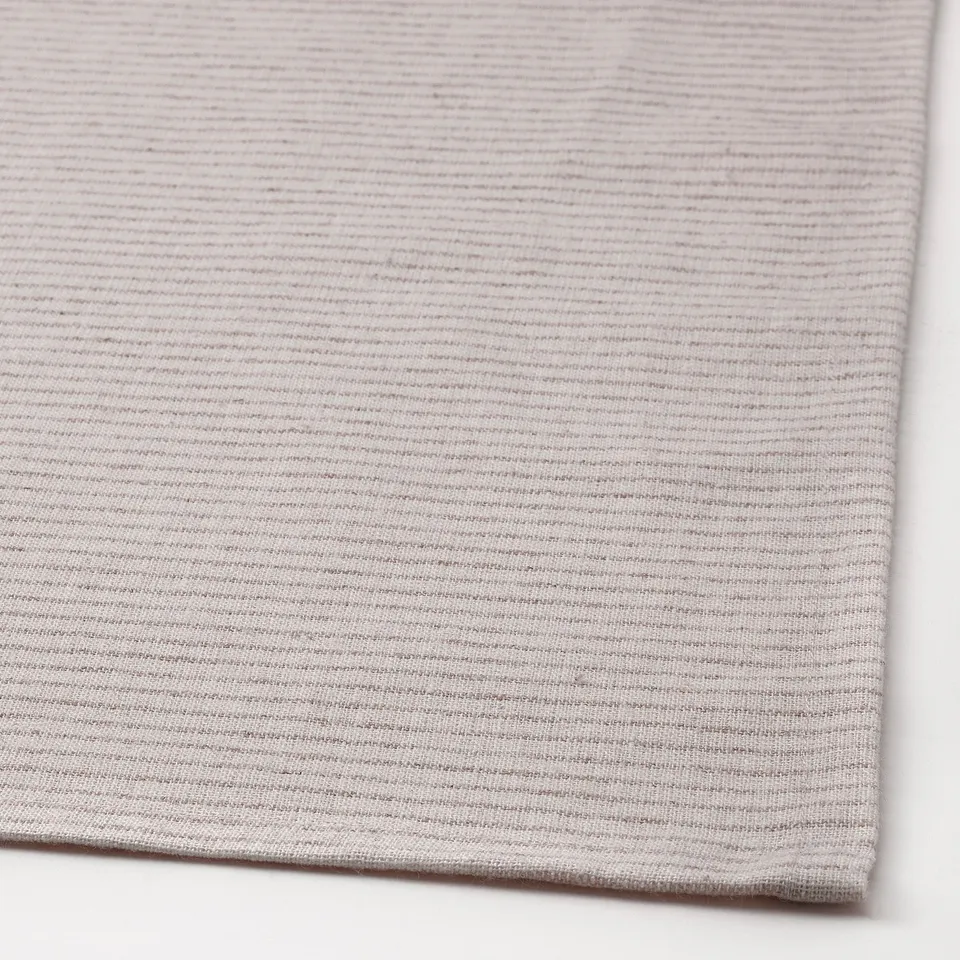 Textured tablecloth with woven cotton and jute. Natural, warm appearance. Thick, protective fabric.