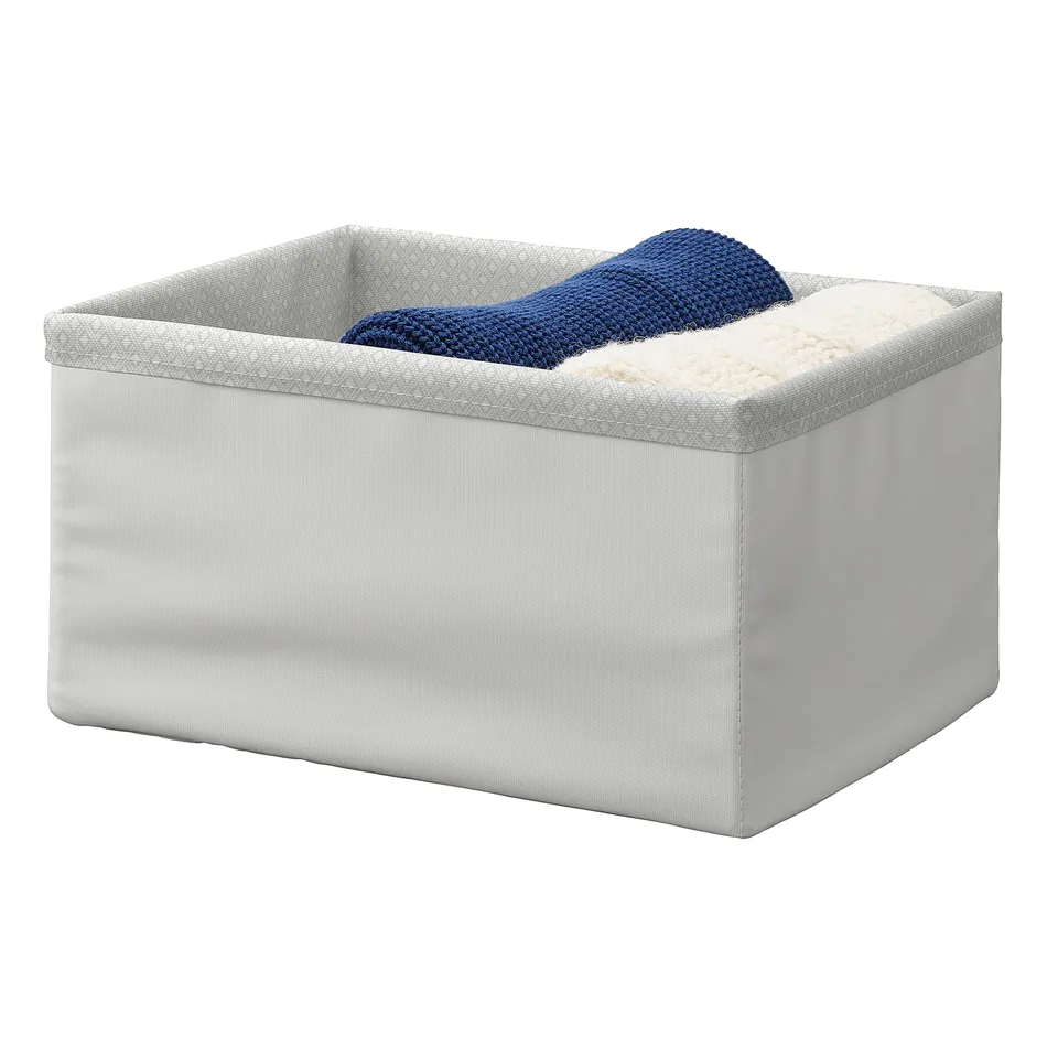 A grey BAXNA storage box with a blue knitted item inside, organised and ready for use.