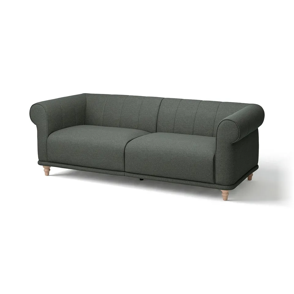 VISKAFORS green sofa: classic, cushioned design with rolled arms, wooden legs. Comfortable, inviting seat.
