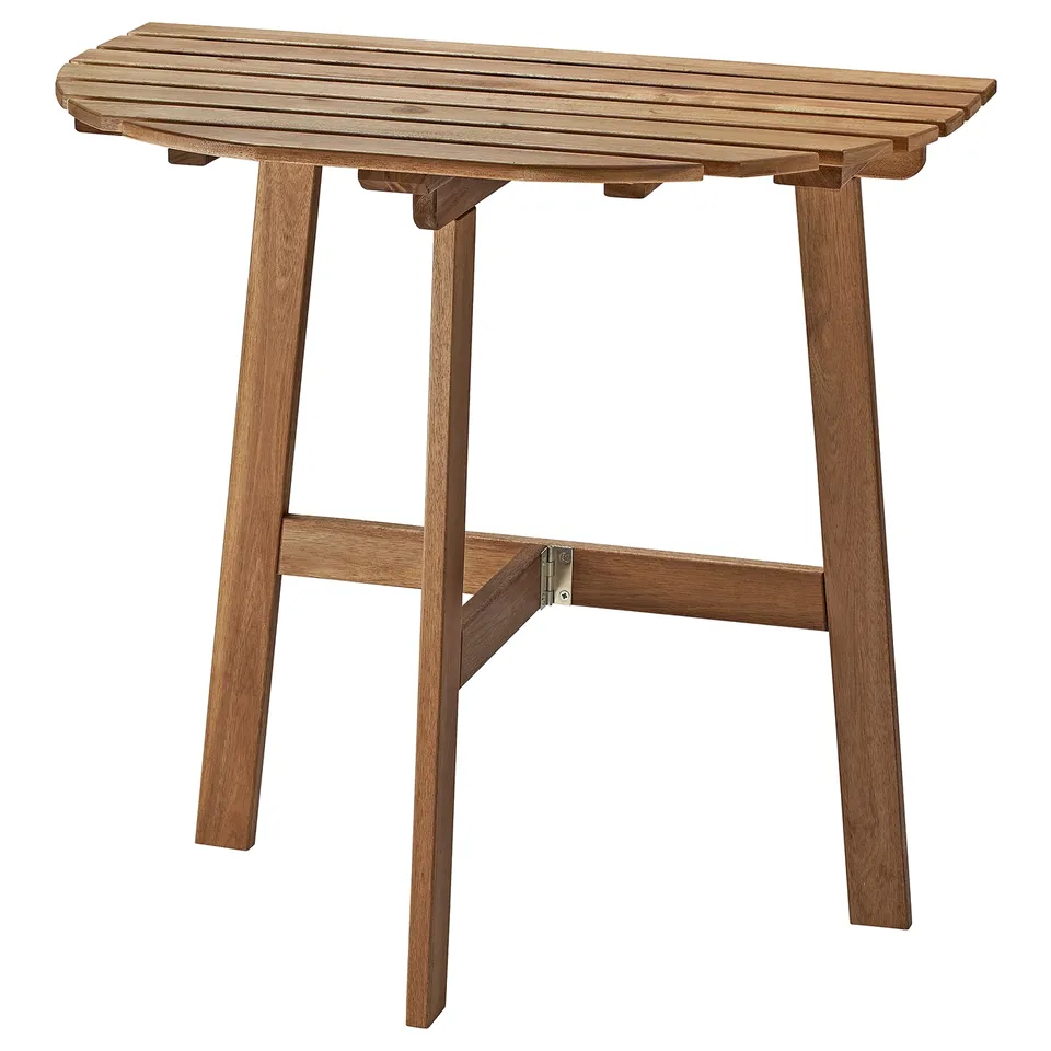 An ASKHOLMEN wooden outdoor table in brown. It a rectangular top and foldable legs for space-saving. Made from durable acacia wood.