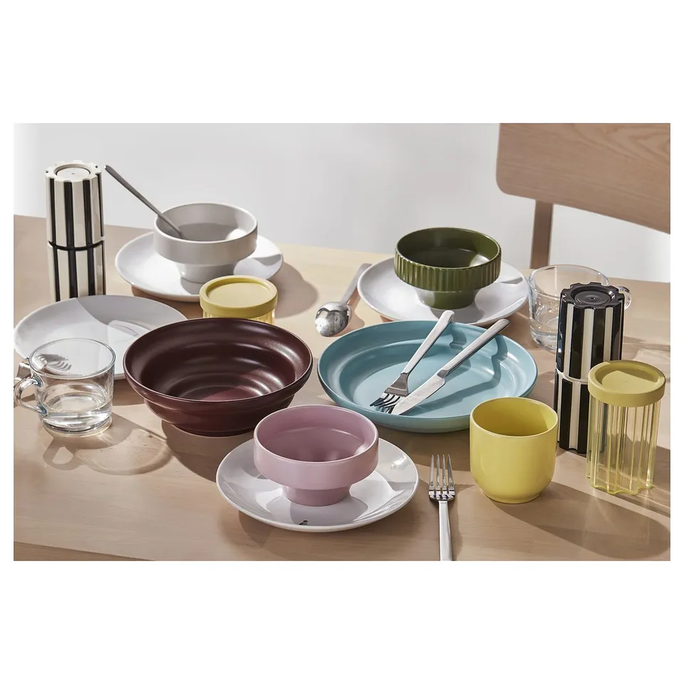 Colourful dinnerware set: bowls, plates, cups. Material: stoneware. Contemporary design.