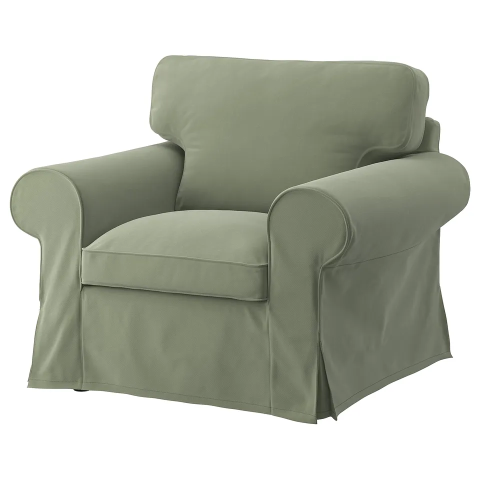 Green EKTORP armchair, soft cushions, rounded arms, removable cover.