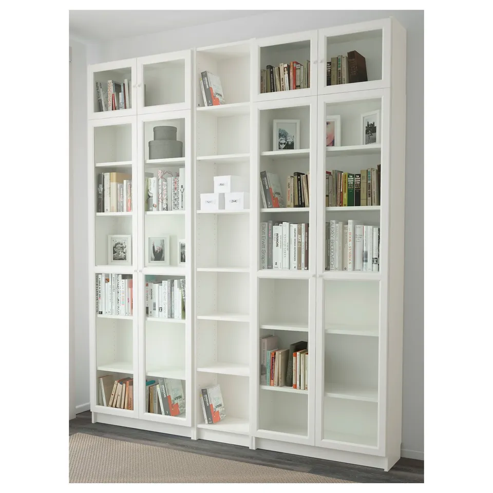 White bookcase with glass doors; holds books, has adjustable shelves.