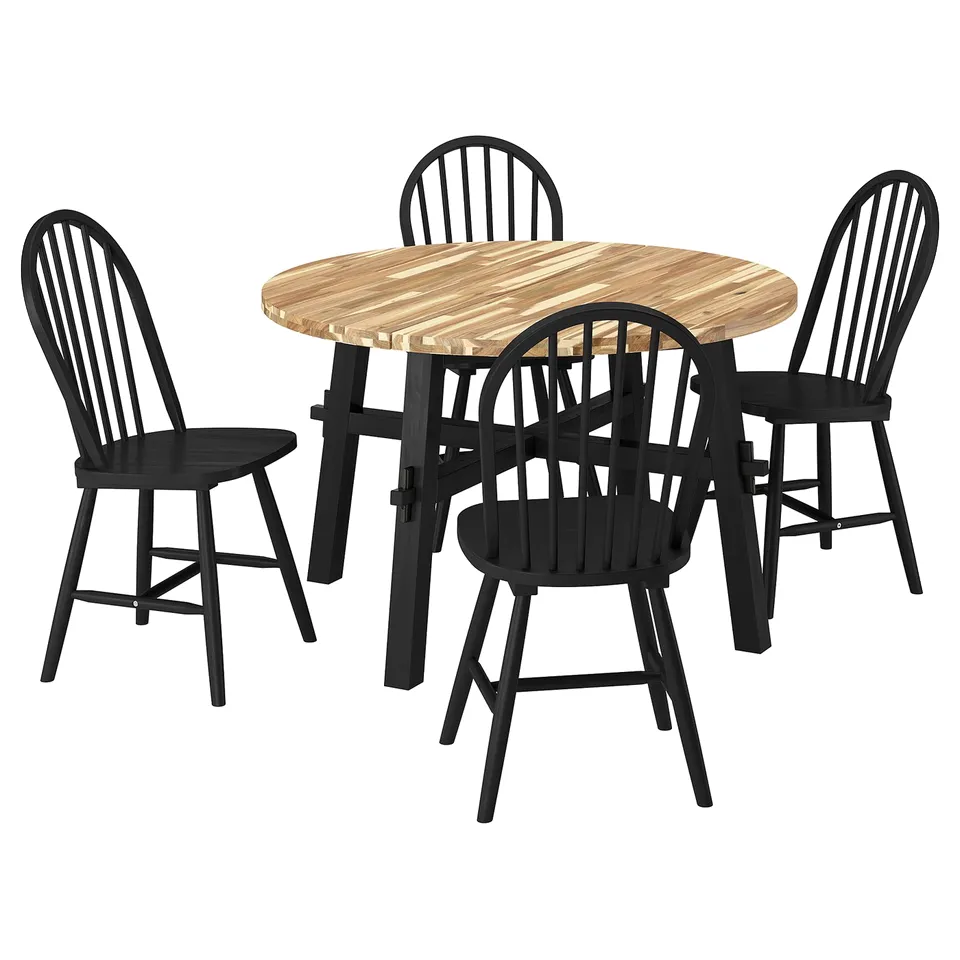 SKOGSTA dining set. Black chairs with wooden seats, round light brown table. Modern, simple, stylish.