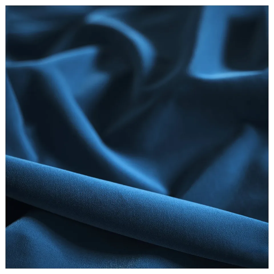 As a close-up of luxurious indigo fabric, crisply folded, showcasing smooth texture and rich depth.