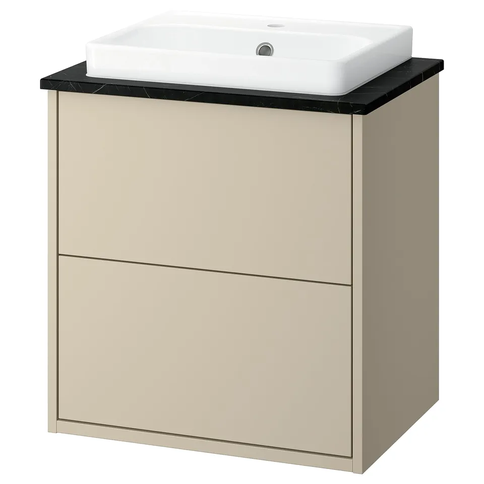 A beige bathroom cabinet with a black countertop and a white square sink. Simple, modern design.