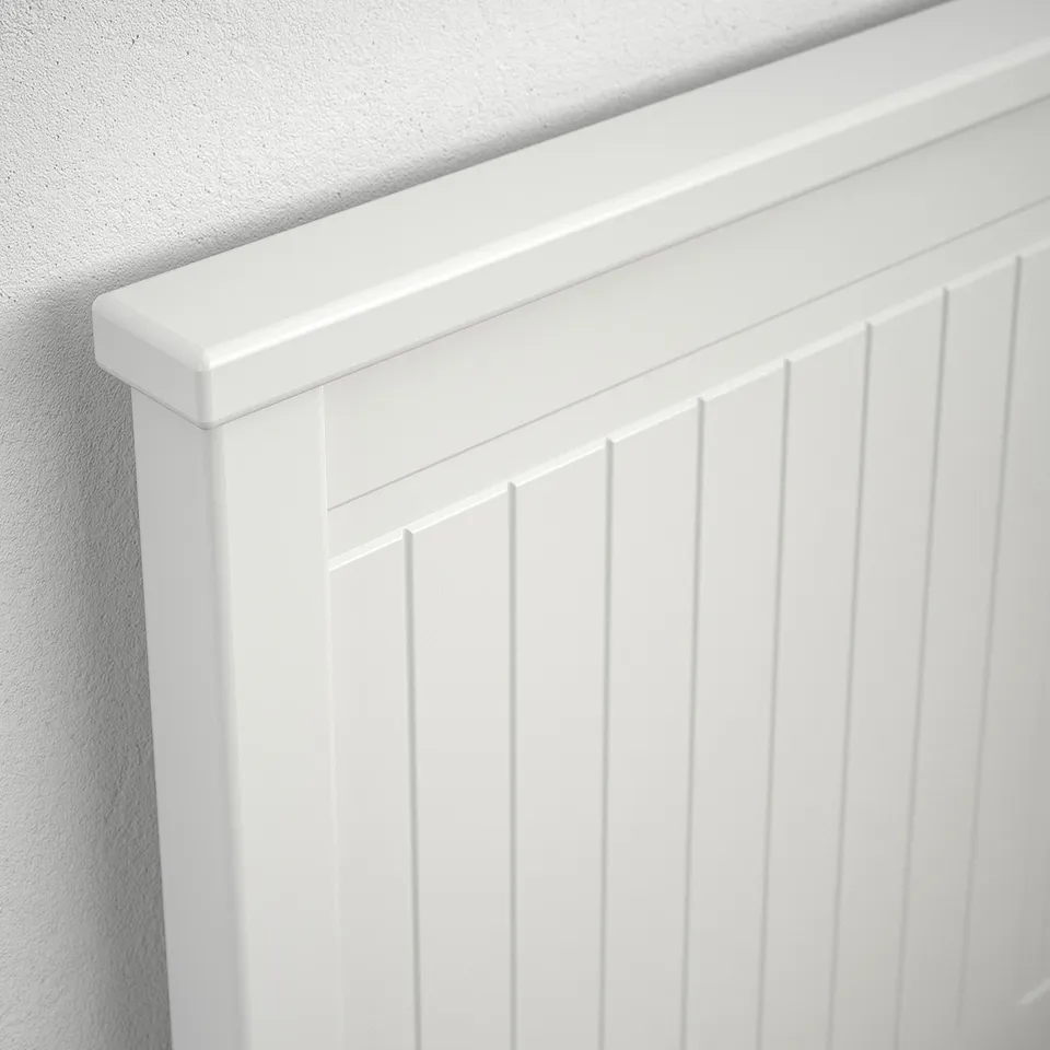 Close-up of high-quality white bevelled wooden panel; smooth finish, sturdy construction.