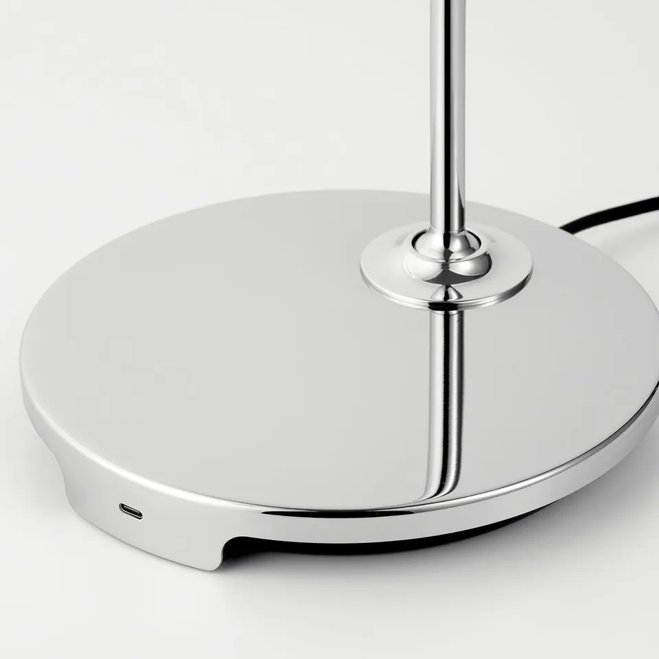 Modern desk lamp with chrome base, featuring usb-c port for fast charging.
