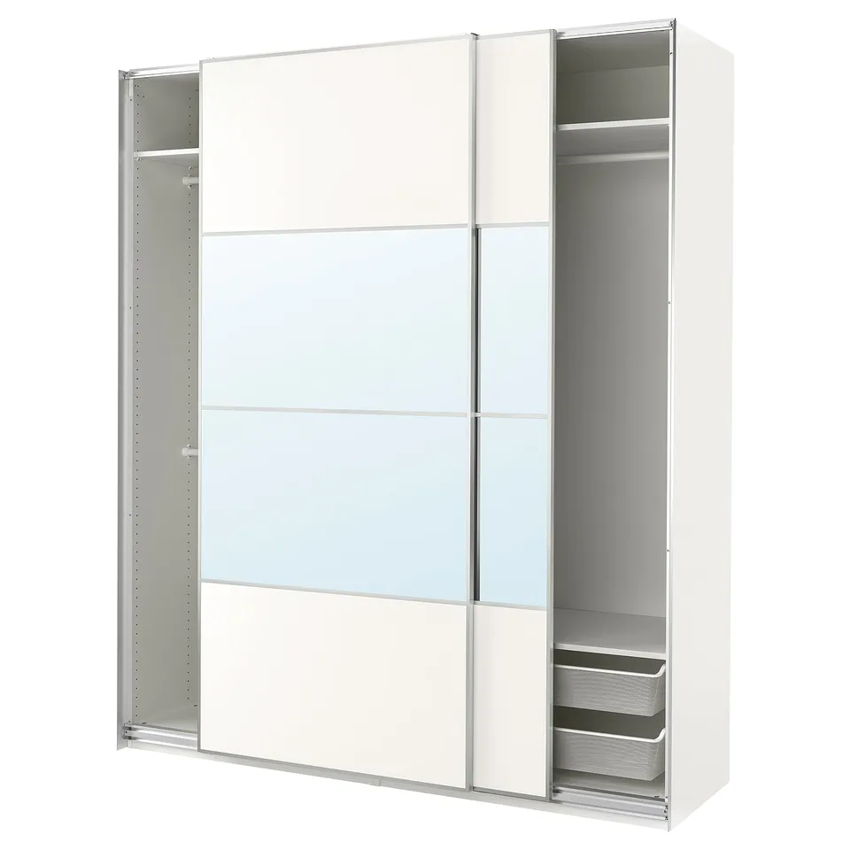 A white ikea PAX wardrobe with mirrored sliding doors and metal mesh drawers.
