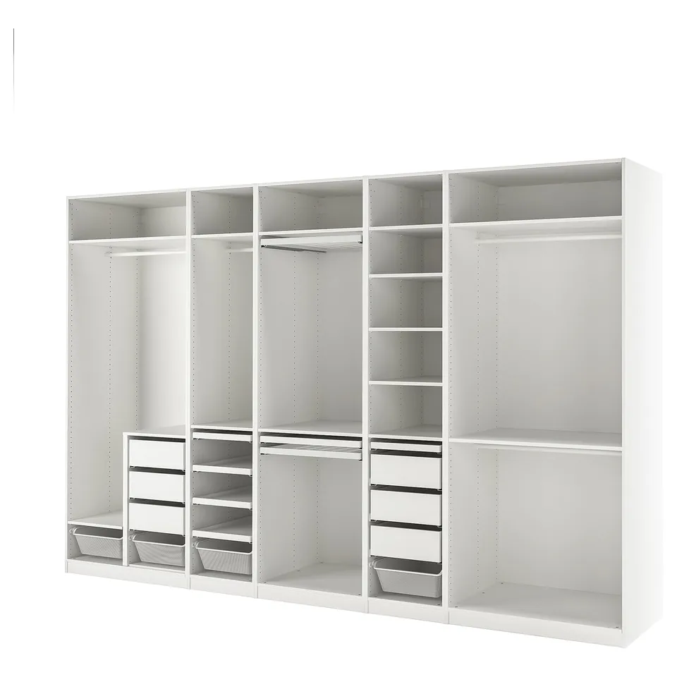 White PAX storage system with open shelves, drawers, and hanging space.