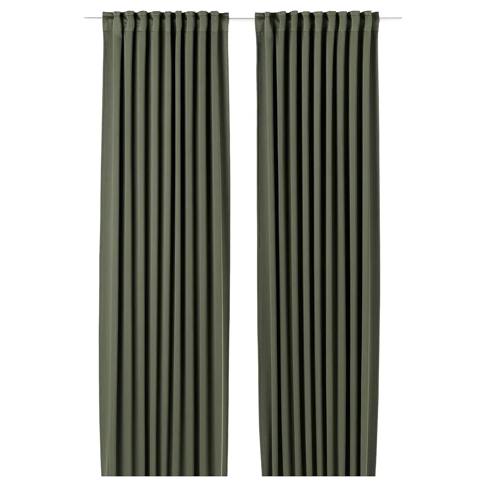 Two dark green MAJGULL block-out curtains with pleated design hang side by side.