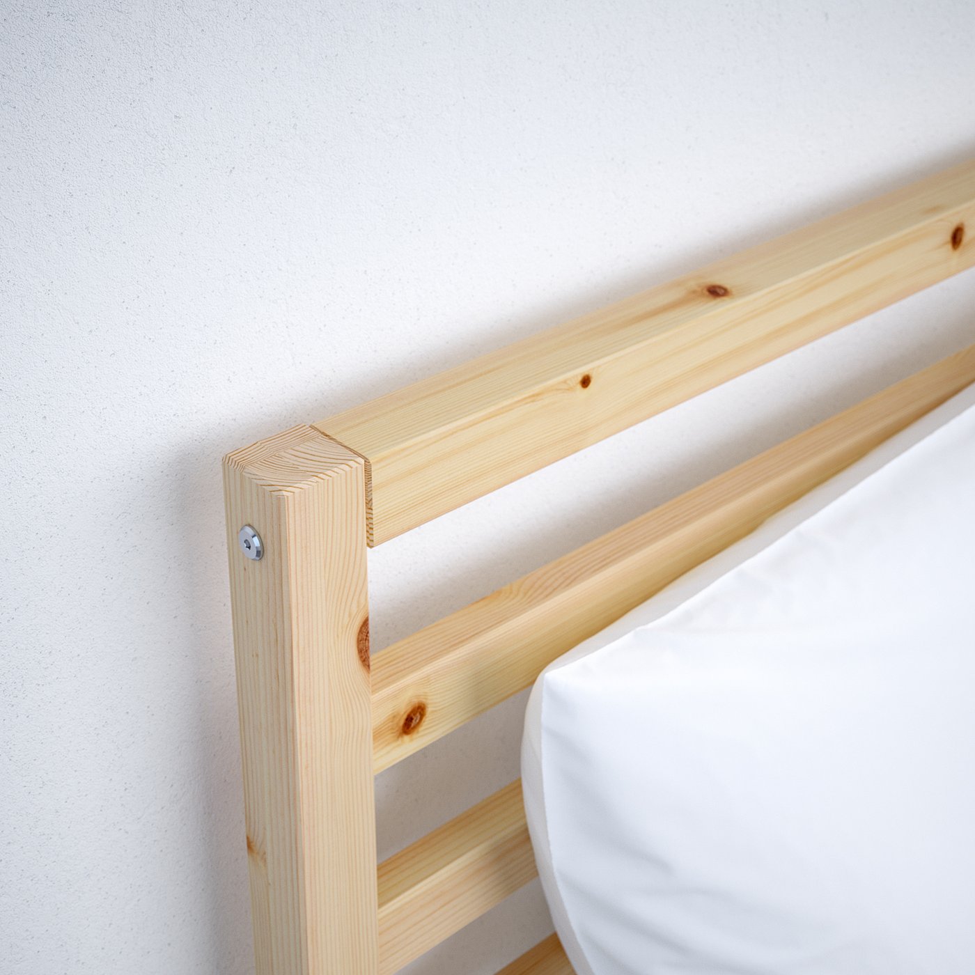 Close-up of sturdy wooden bed frame corner, showcasing quality pine wood finish.