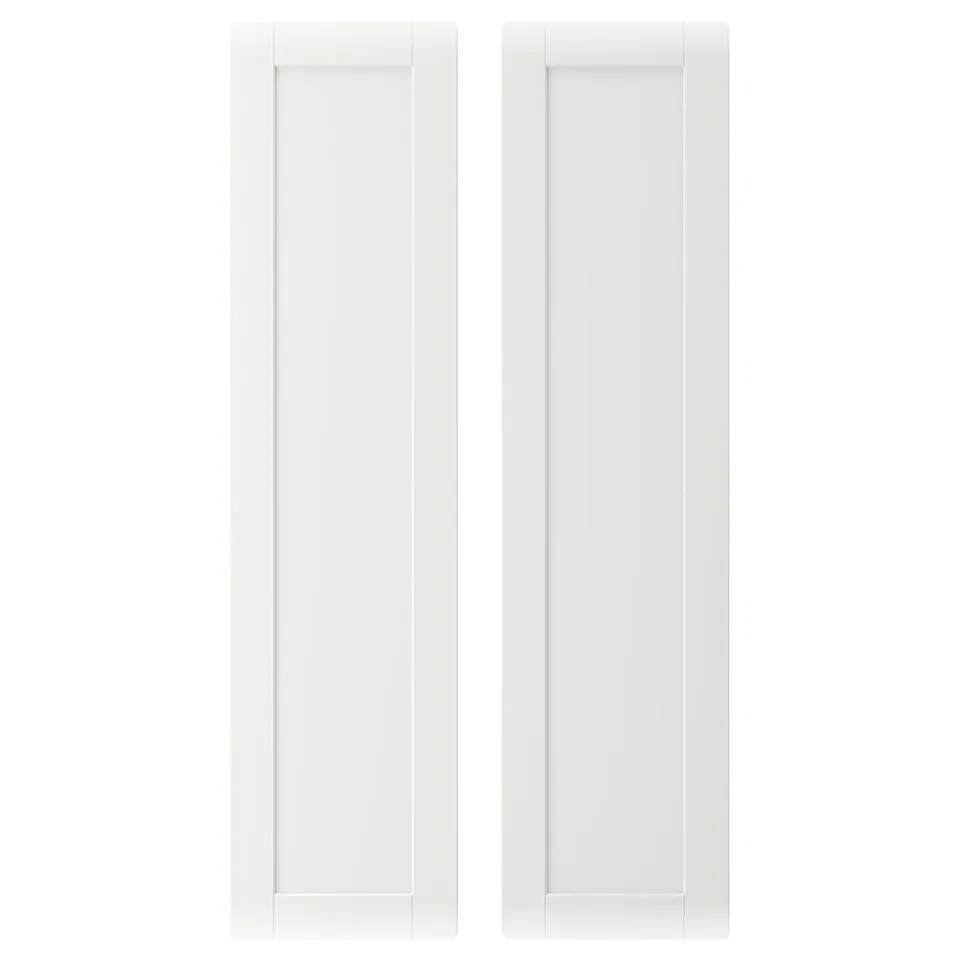 This image two white rectangular SMÅSTAD cabinet doors made of fibreboard, aligned side by side, showcasing clean lines and a simple design.
