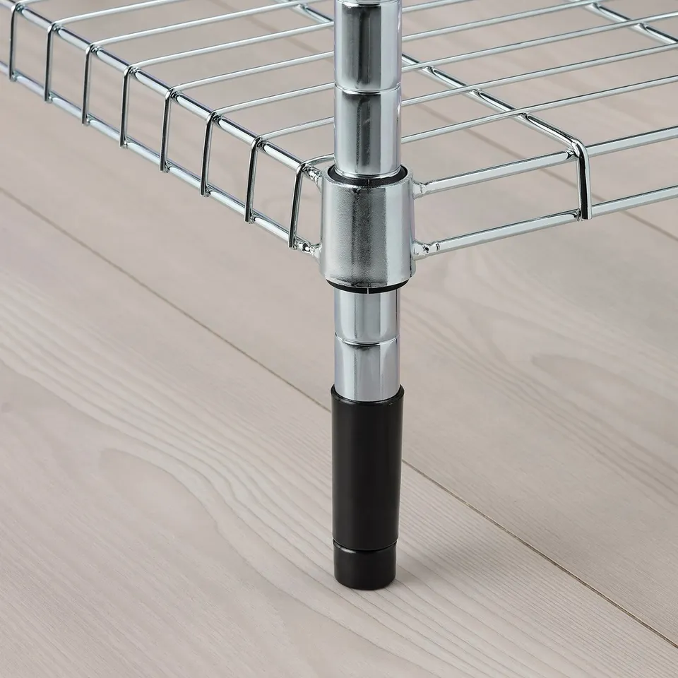 Close-up of adjustable metal shelf with chrome post and black foot. Modern and sturdy design.