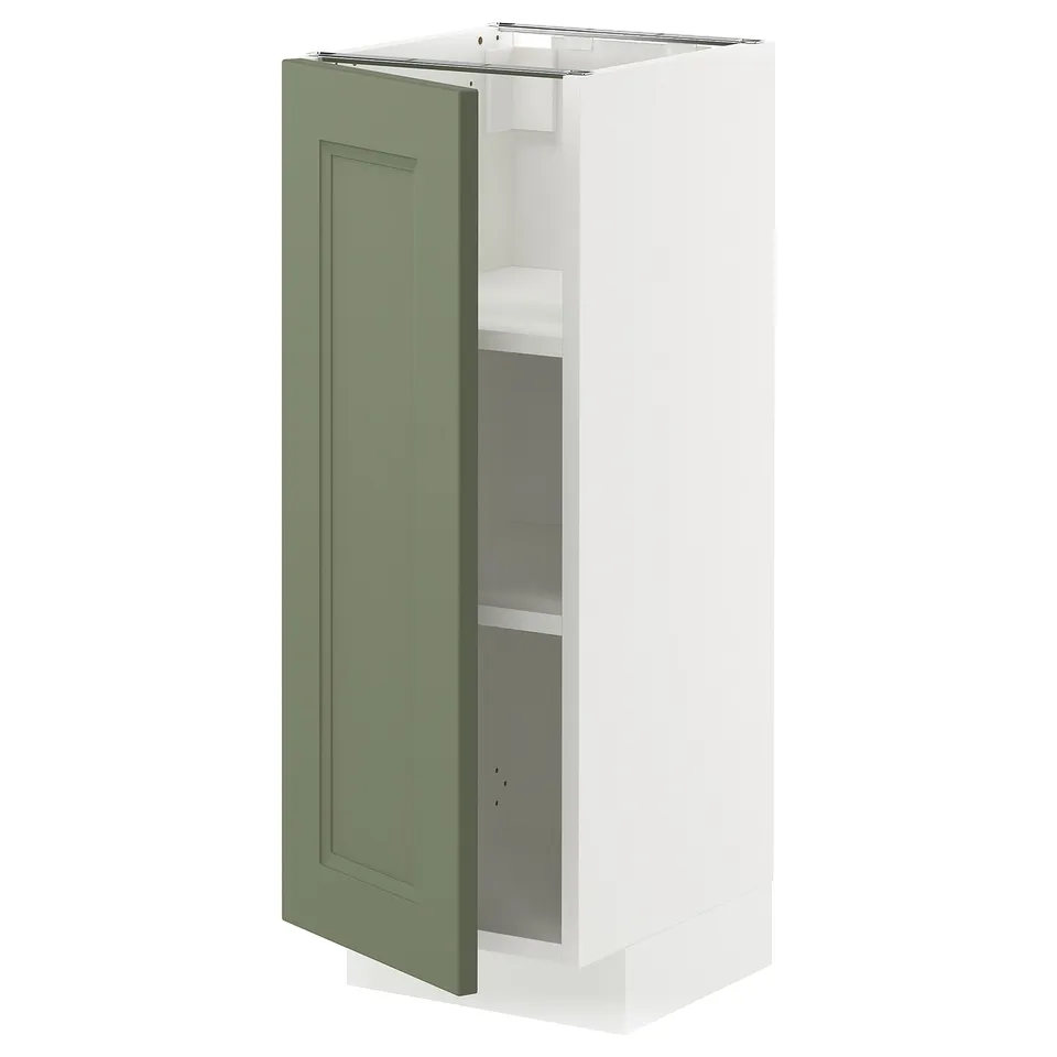 White kitchen cabinet with green door open, showing shelves.