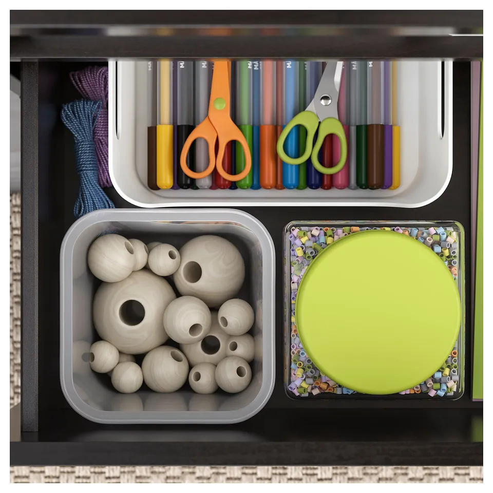 Organised craft drawer with beaded boxes: light wood beads, colourful scissors, pens, and beads.