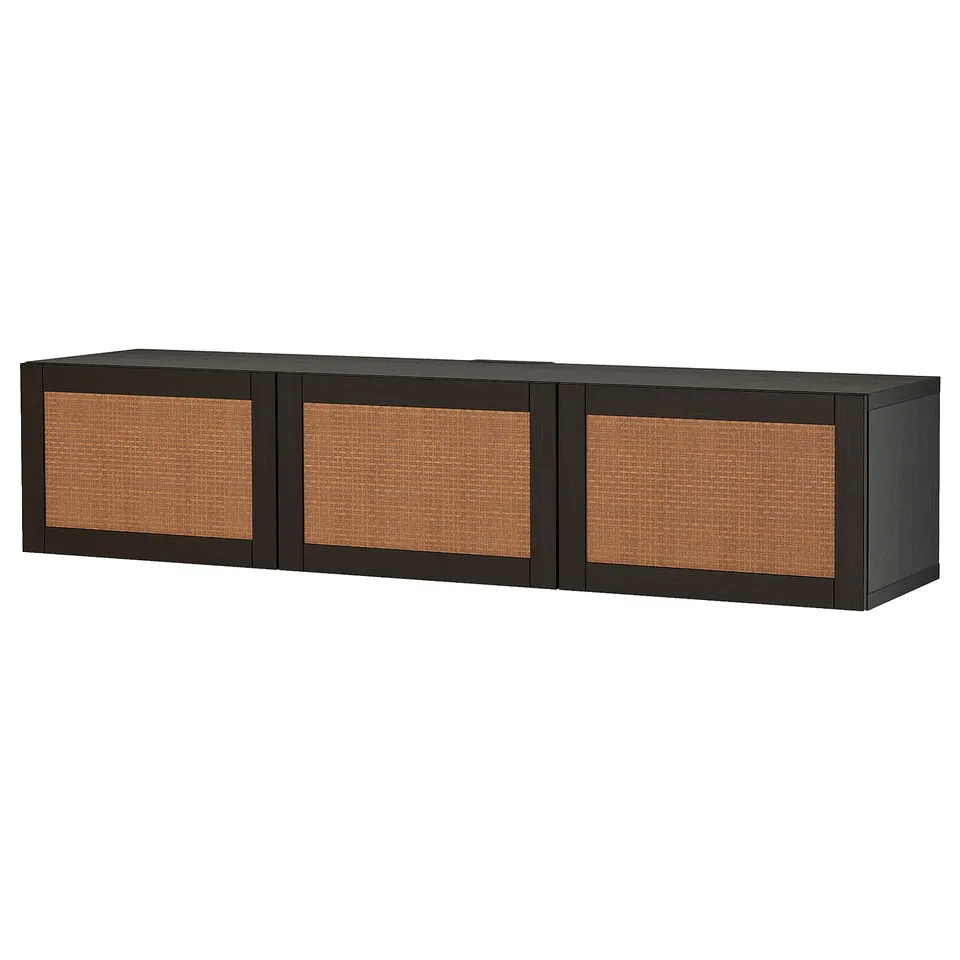 A black, rectangular BESTÅ tv bench with three woven cane doors, designed for cable management and adjustable shelves.