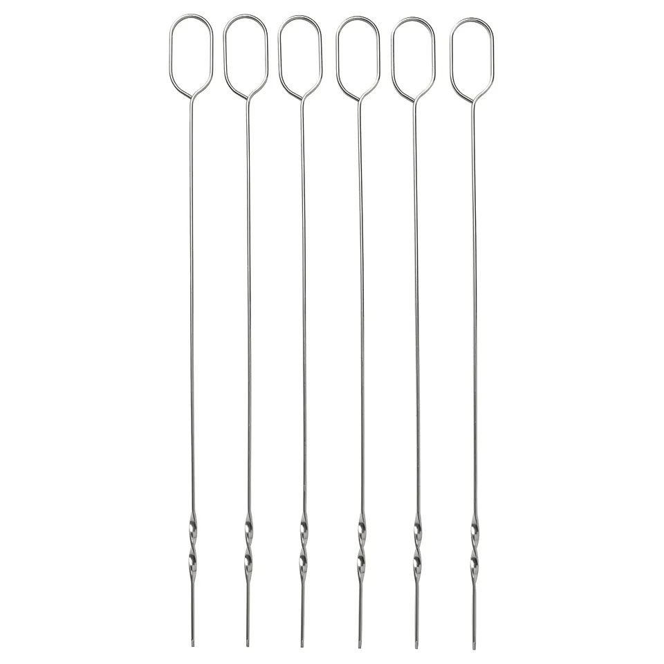 Six stainless steel skewers with oval handles laid out side by side.