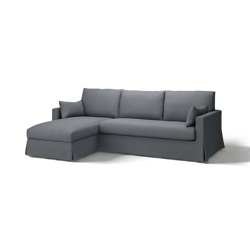 Grey l-shaped sofa with clean lines, upholstered in gransel fabric with linen and viscose, offering a relaxed and inviting look.