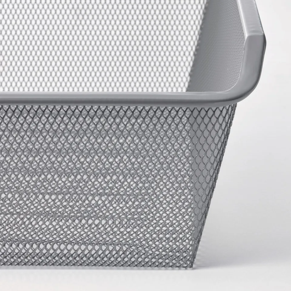 Silver mesh basket with diamond patterns, showcasing its sturdy and ventilated design.