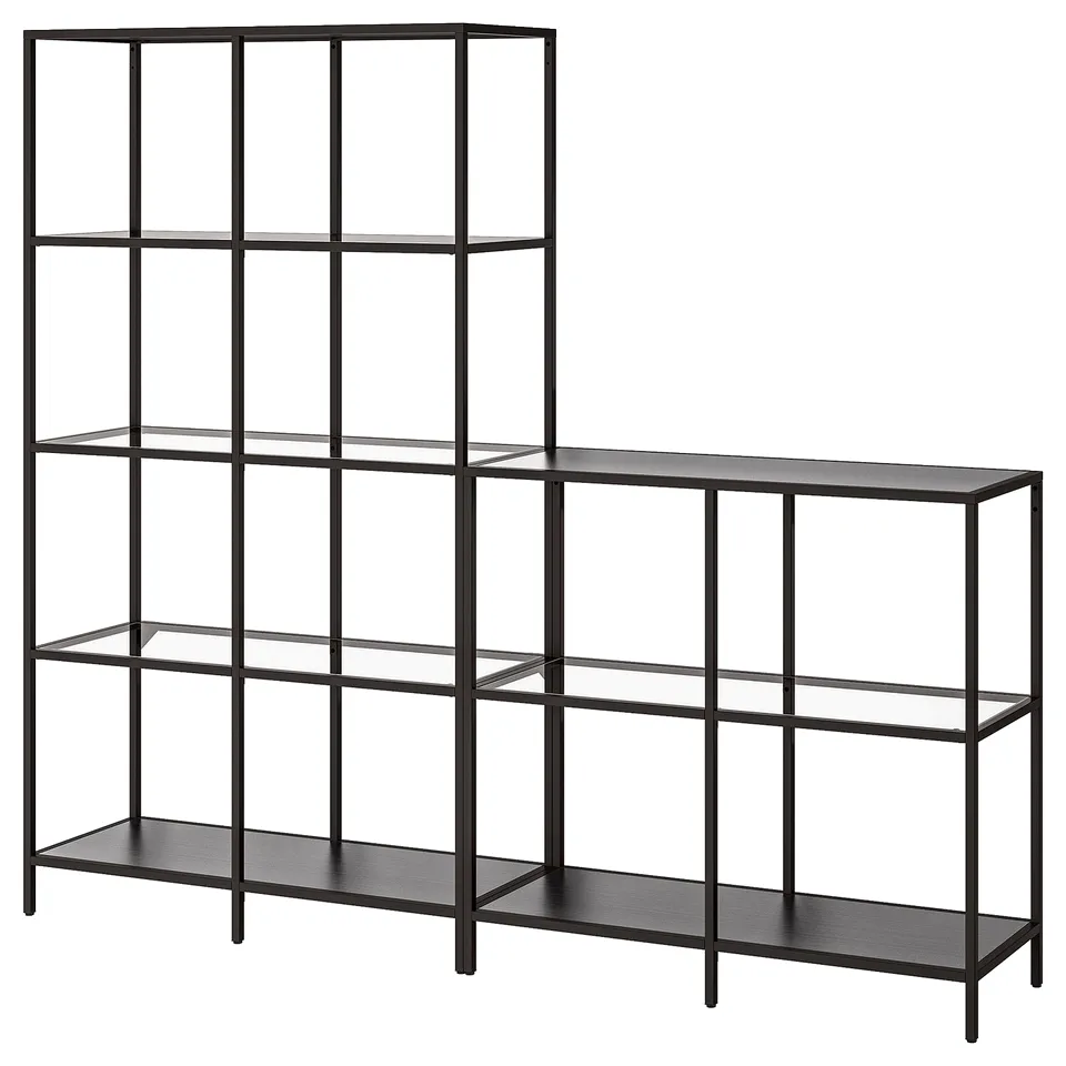 A black VITTSJÖ shelving unit with glass shelves, modern design, standing tall and wide.