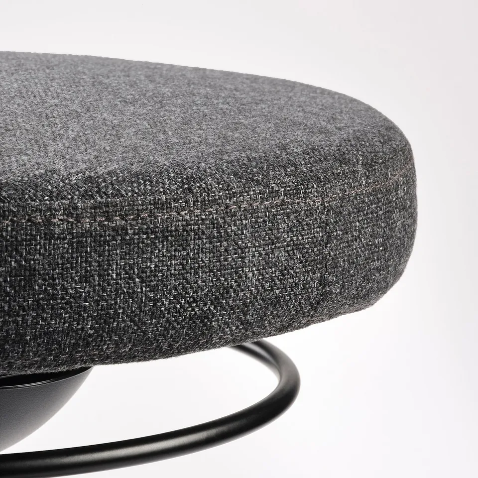 Modern office chair with grey upholstered seat and curved metal base for active sitting.