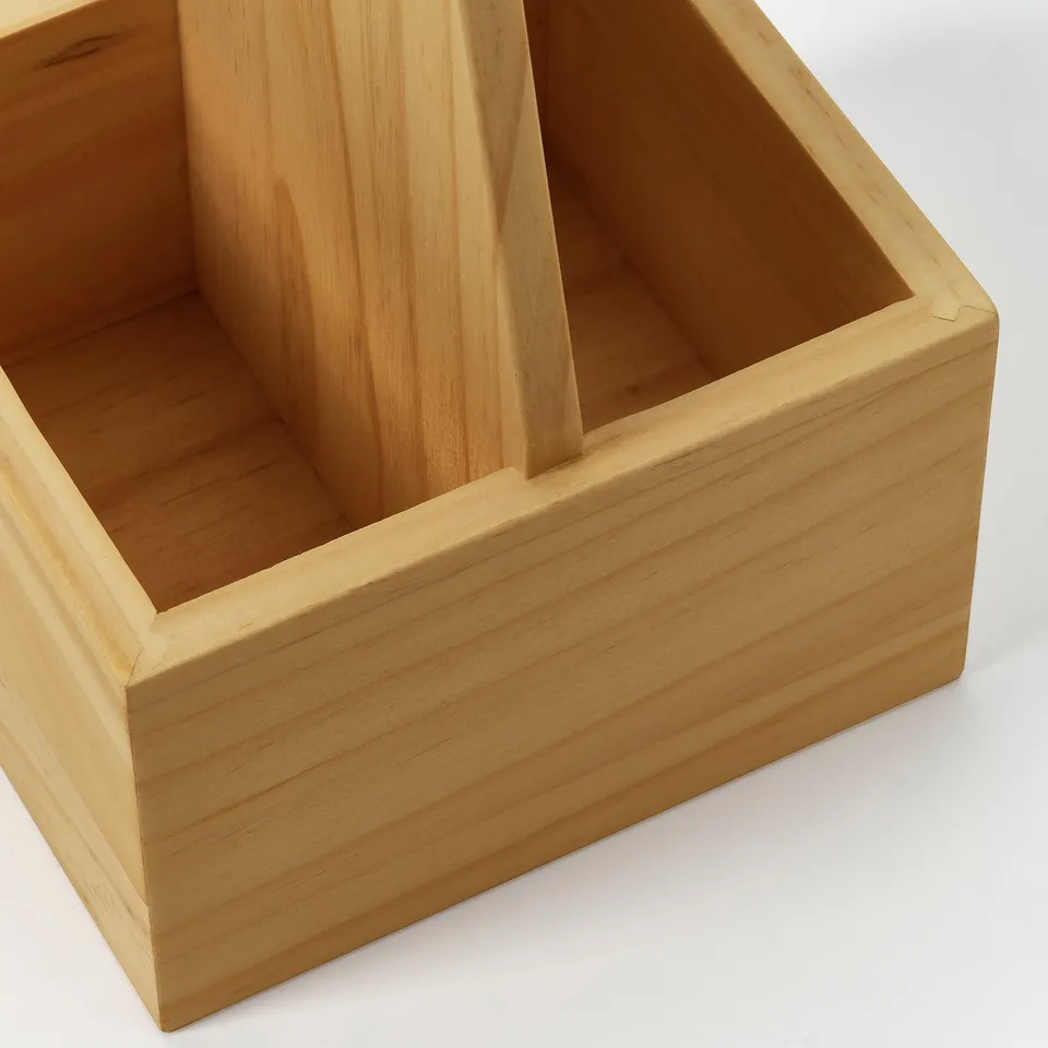 Wooden storage organiser with divided compartments, crafted from solid pine, perfect for kitchen use.