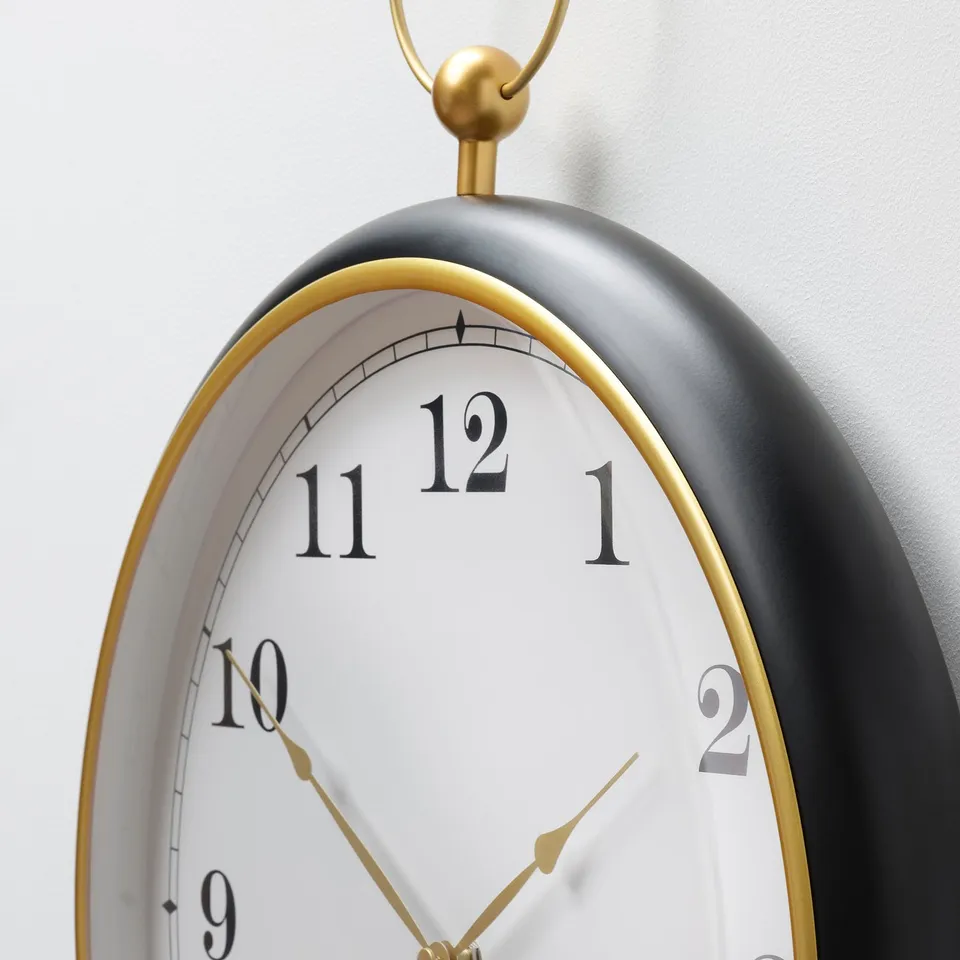 Vintage-styled pocket watch clock, matte black with gold accents.
