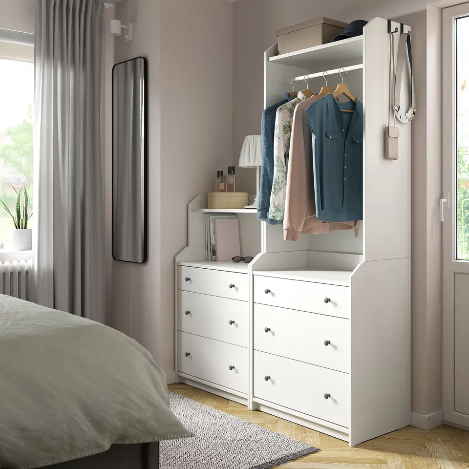 HAUGA storage in bedroom with drawers, shelves, lamp, books, mirror, plant, and bed.